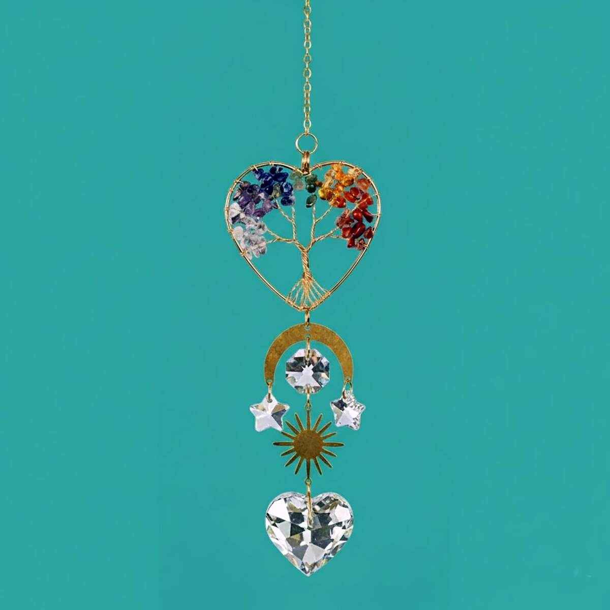 chakra heart suncatcher hanging in window