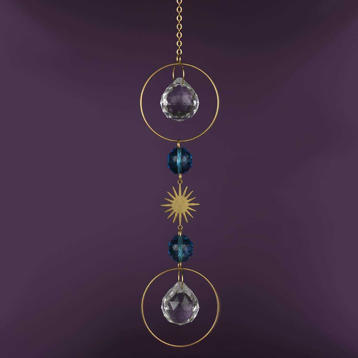 blue and clear crystal suncatcher with gold chain and sun.