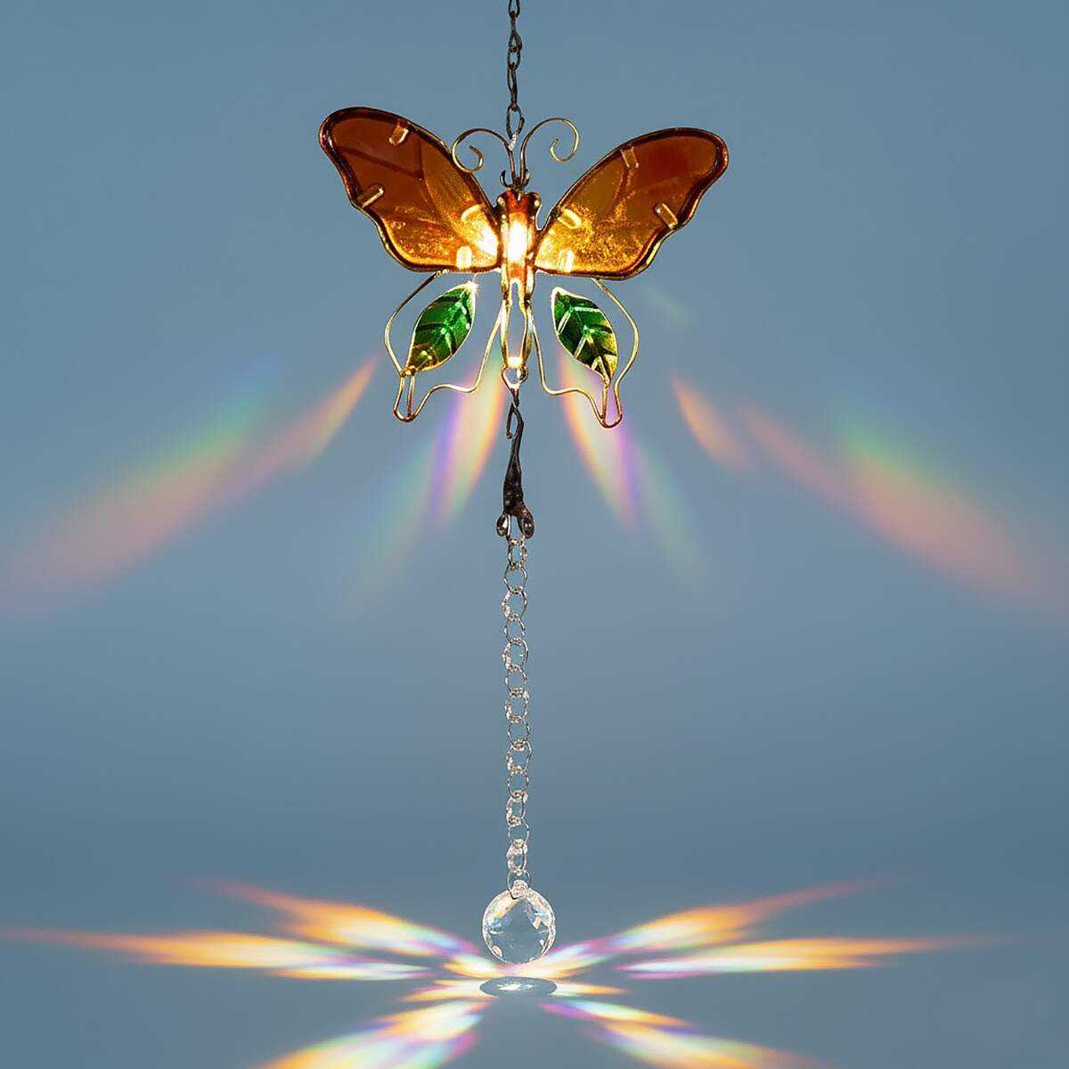 butterfly suncatcher with crystals on blue background