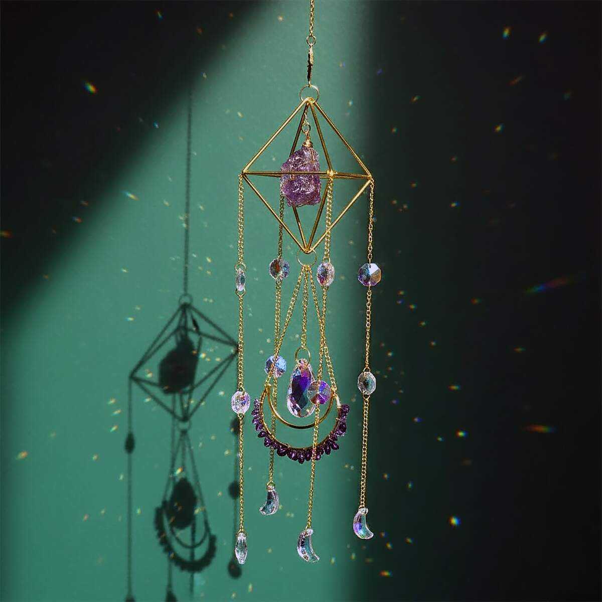 large amethyst suncatcher on green wall